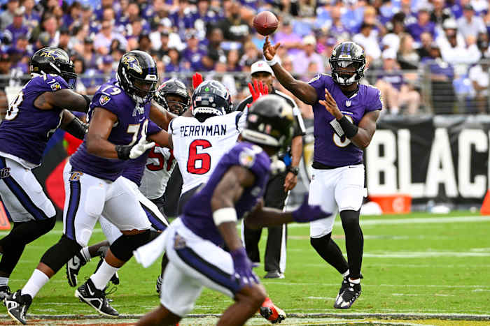 Ravens quarterback Lamar Jackson (8) throws a pass to wide receiver Zay Flowers (4) against the Houston Texans during the second half at M&T Bank Stadium.